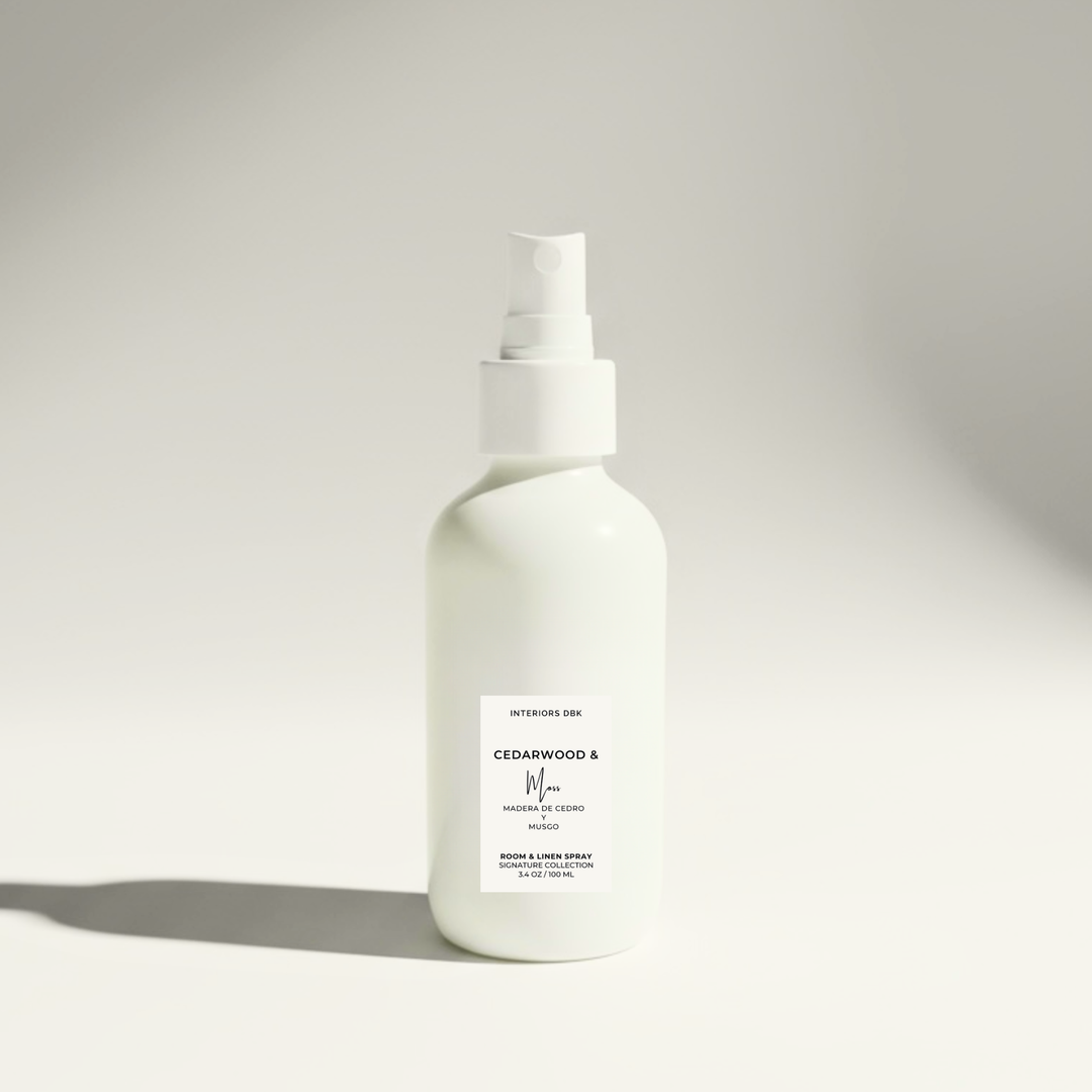 Cedarwood & Moss room and linen spray by Interiors DBK in reusable white glass bottle, clean woody home fragrance.