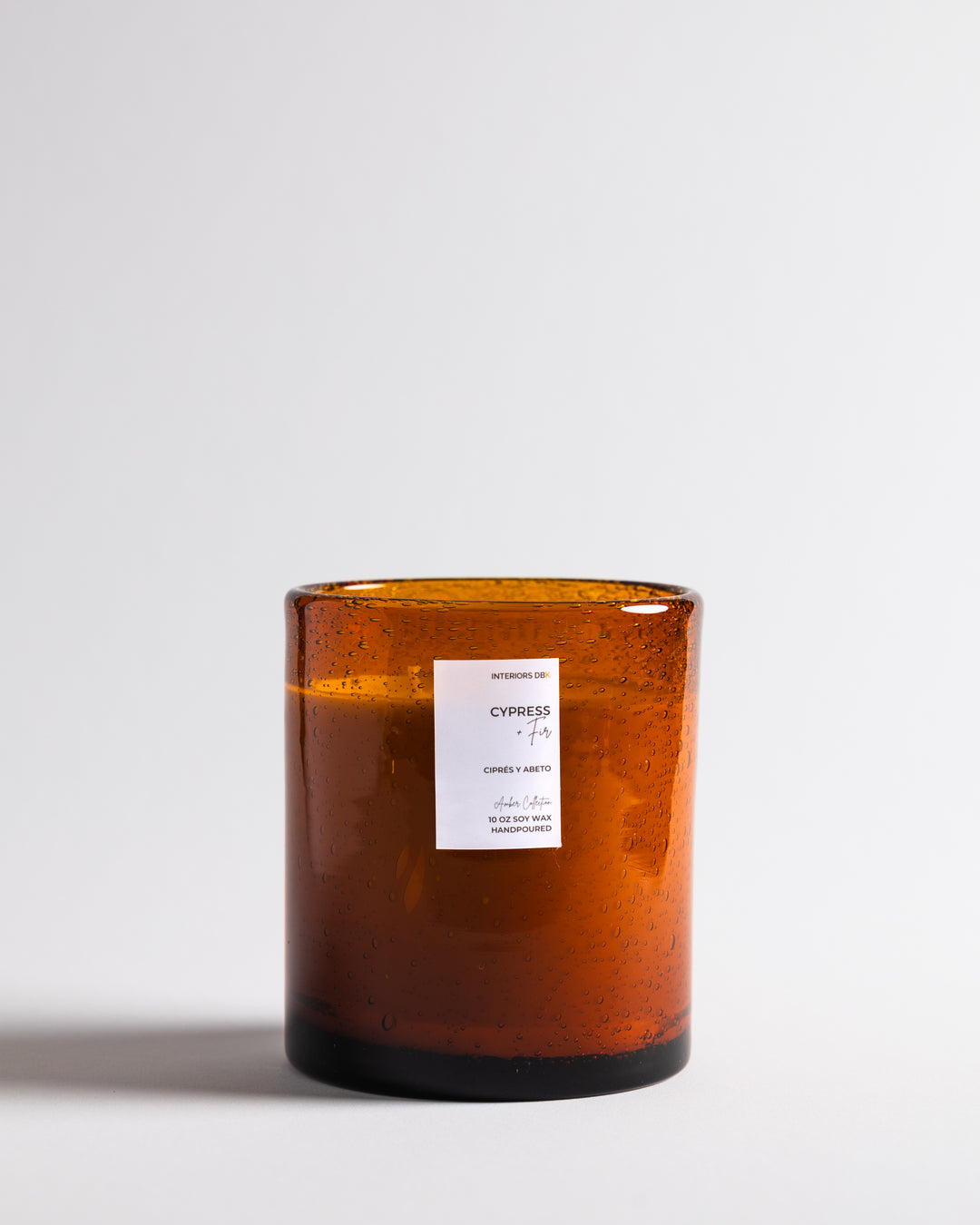 Cypress & Fir soy candle in reusable amber glass. Sustainably made.