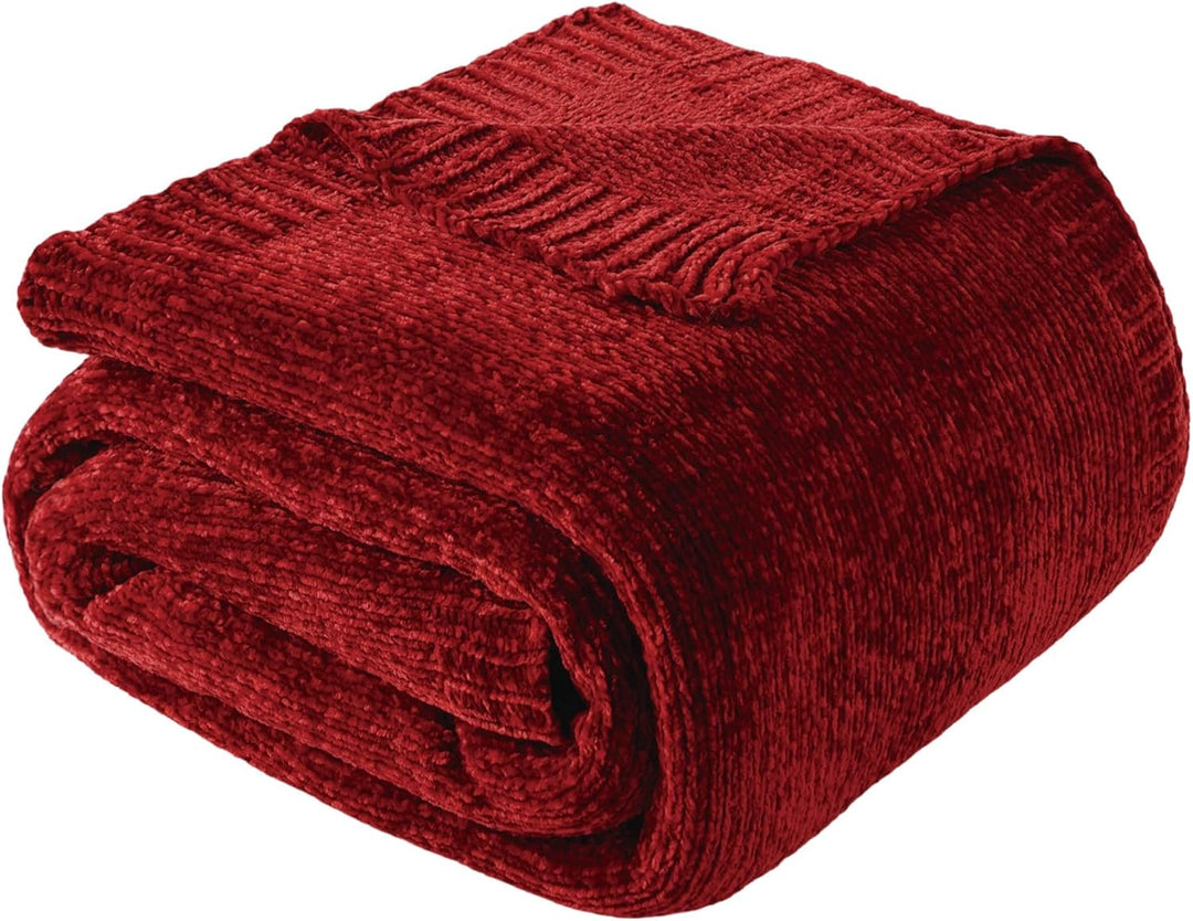 Burgundy red chenille knit throw blanket folded on white background