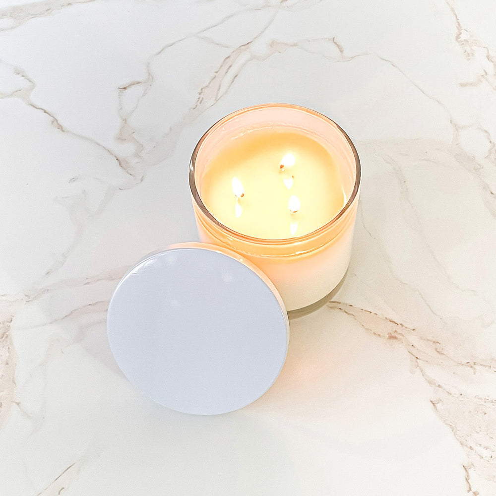 Top view of the large-sized cedarwood soy candle in a lit state, creating a warm and inviting ambiance.