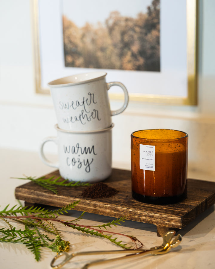 Late Night Bonfire soy candle in hand-blown amber glass, eco-friendly and reusable. A luxury fall fragrance for cozy autumn evenings.