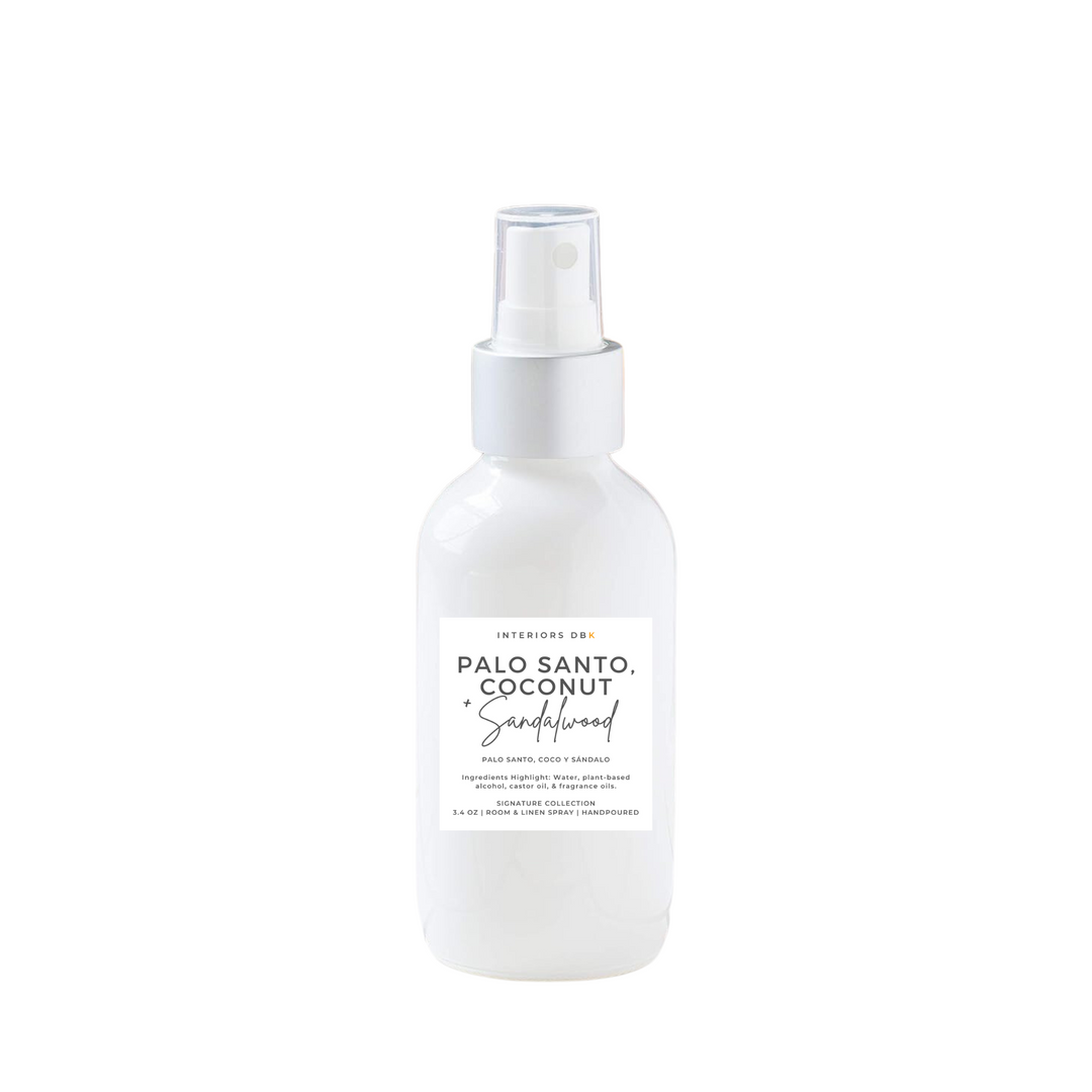 Palo Santo, Coconut & Sandalwood room spray in reusable white glass bottle.