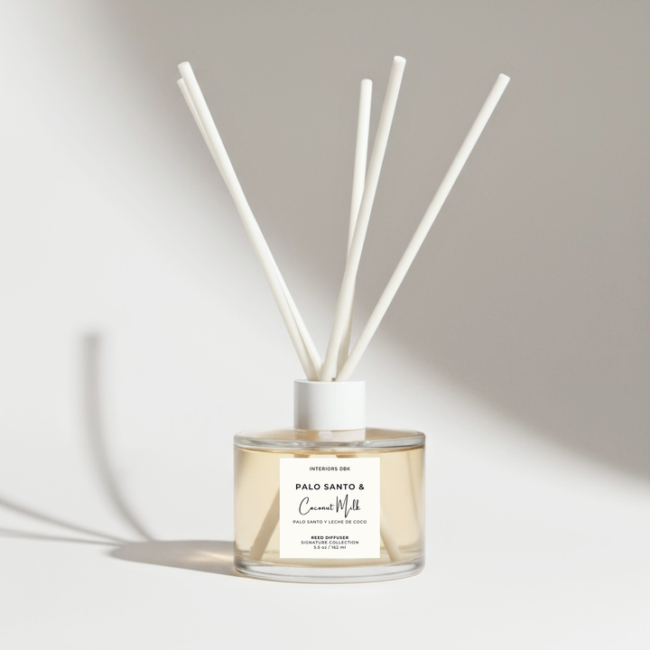 Palo Santo and Coconut Milk reed diffuser 5.5 oz with white fiber reeds, luxury tropical woody home fragrance by Interiors DBK.