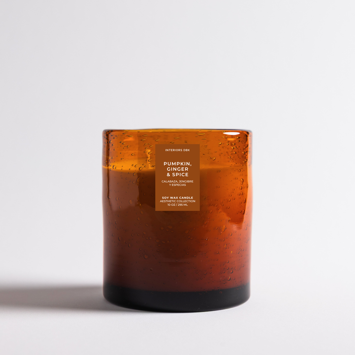 Pumpkin, Ginger and Spice soy wax candle handmade by Interiors DBK. Amber glass candle product image.