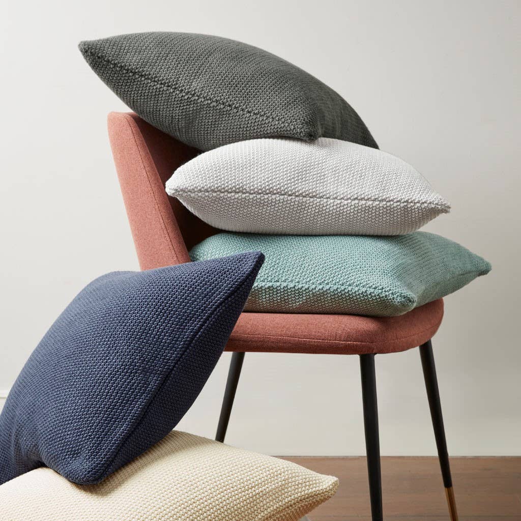 The ultimate soft and cozy layering knit throw pillow perfect for your living room, entryway or bedroom. A minimalist design featuring a hidden zipper closure ideal for any space.